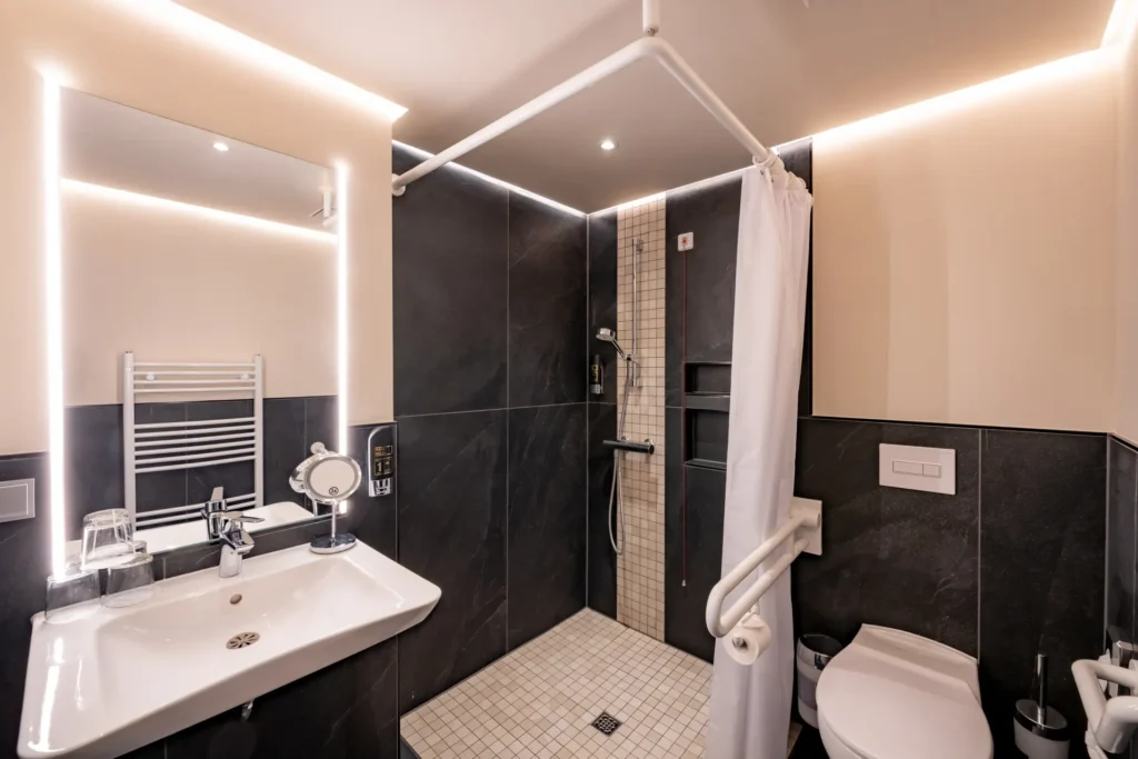 View of sink and shower in a room at K6 