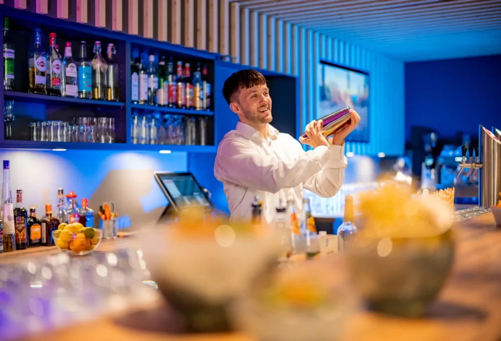 Bartender preparing a cocktail in the bar of the Mixed Zone of K6